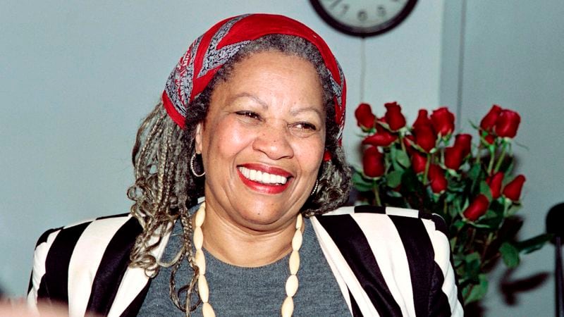 Toni Morrison smiles in her office at Princeton University while being interviewed by reporters after hearing that she had won the Nobel Prize for Literature.