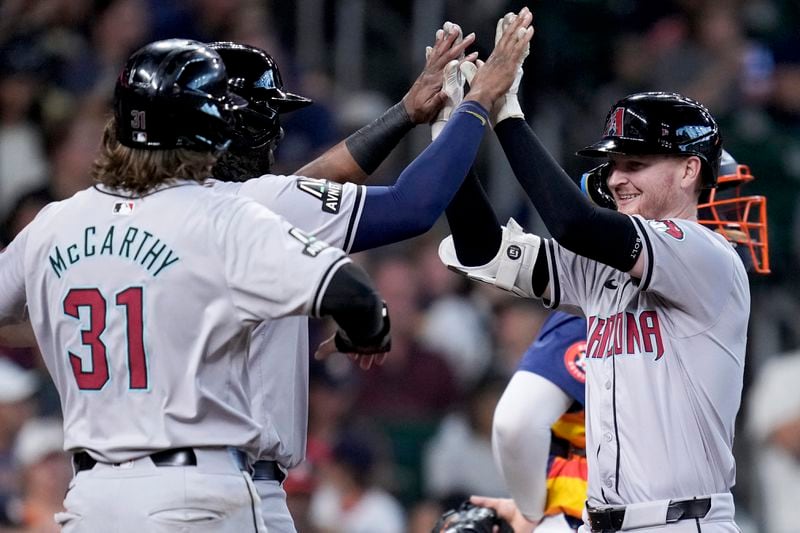 Arizona Diamondbacks' Pavin Smith, right, celebrates after his grand slam against the Houston Astros during the third inning of a baseball game Sunday, Sept. 8, 2024, in Houston. (AP Photo/Eric Christian Smith)