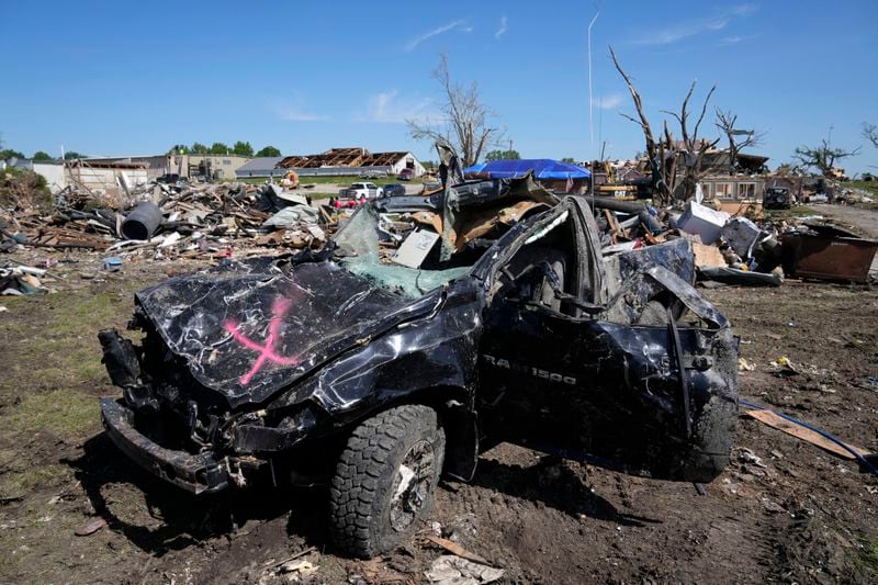 FILE - A tornado damaged truck sits in a lot, Thursday, May 23, 2024, in Greenfield, Iowa. Experts say that planning is key before a tornado threatens. They say weather radios, basements and bicycle helmets all save lives. Record warmth this winter provided the fuel for a deadly tornado outbreak across parts of the Midwest and South in March. (AP Photo/Charlie Neibergall, File)