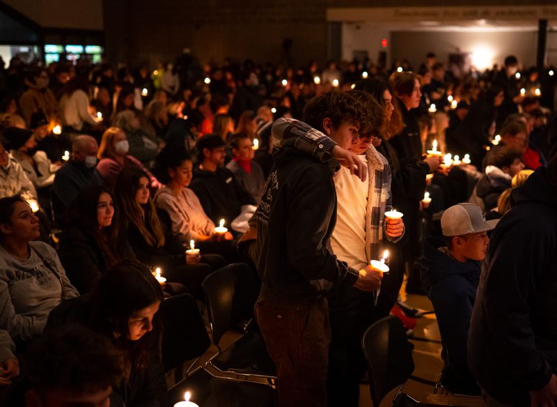 Oxford High School students who were present during the school shooting stand during a prayer vigil at LakePoint Community Church in Oxford, Michigan on Tuesday, Nov. 30, 2021. (Ryan Garza/Detroit Free Press/TNS)