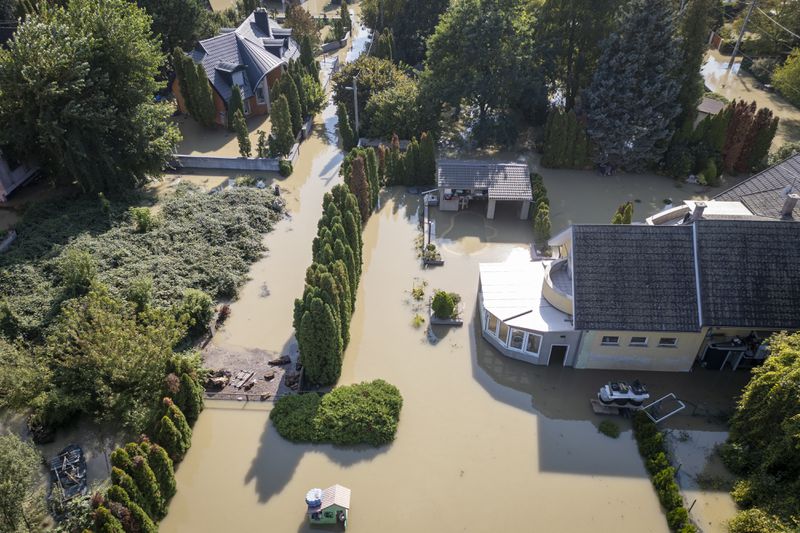 An aerial view of a flooded neighbourhood in Szentendre, Hungary, Thursday, Sept. 19, 2024. (AP Photo/Darko Bandic)