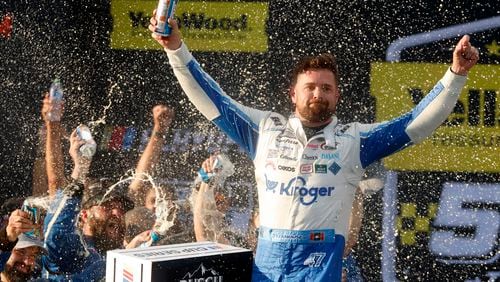 Driver Ricky Stenhouse Jr. celebrates in Victory Lane after a NASCAR Cup Series auto race at Talladega Superspeedway, Sunday, Oct. 6, 2024, in Talladega, Ala. (AP Photo/ Butch Dill)