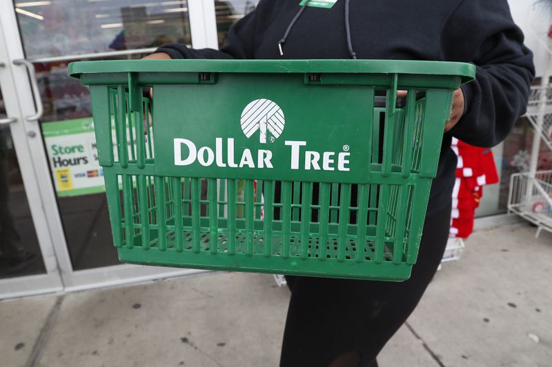 FILE - A clerk brings in a shopping basket at a Dollar Tree store in Richland, Miss., Tuesday, Nov. 26, 2019. (AP Photo/Rogelio V. Solis, File)