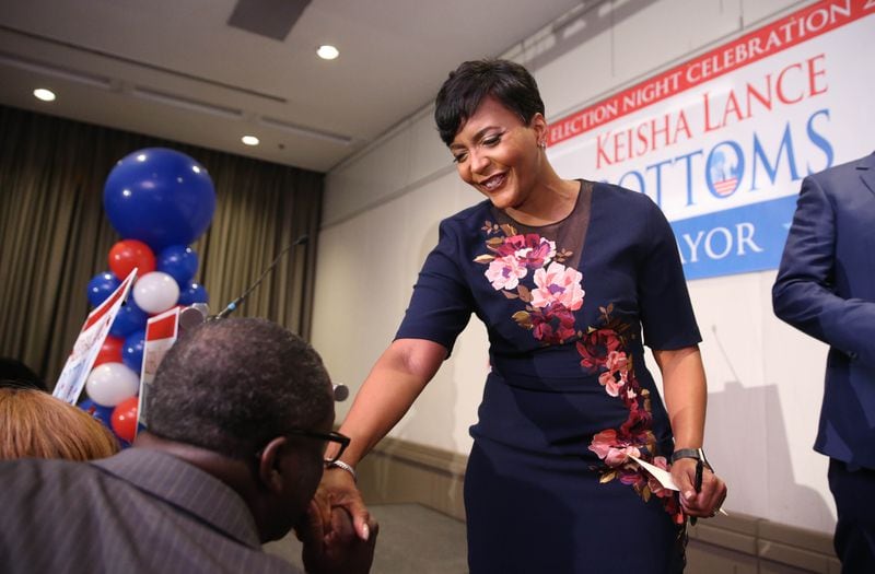 Atlanta mayoral candidate Keisha Lance Bottoms greets a supporter after she spoke briefly during her election watch party.