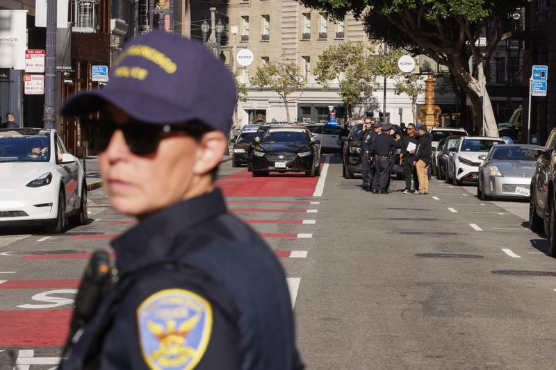 Police officers secure the area and investigate the scene of a shooting at Union Square in San Francisco, on Saturday, Aug. 31, 2024. (Santiago Mejia/San Francisco Chronicle via AP)