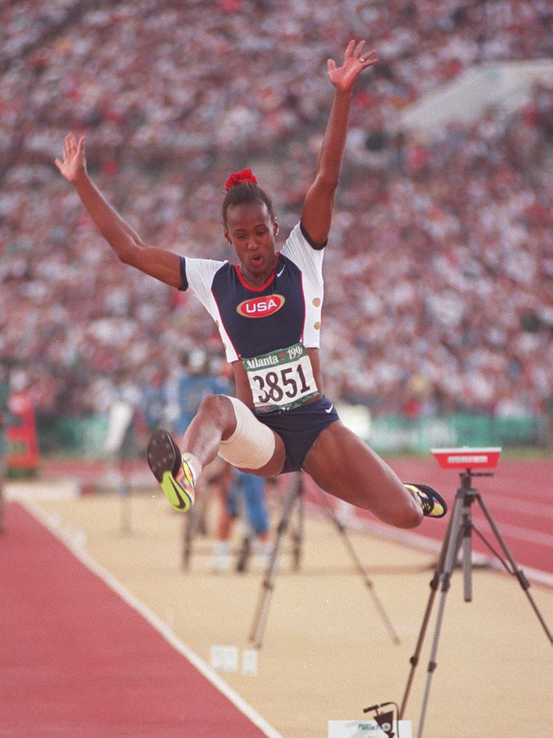 Jackie Joyner-Kersee of the U.S. women's track and field team is airborne for jump #2 in Long jump competition at the Olympic stadium Friday, Aug. 2, 1996, during the 1996 Summer Olympic Games in Atlanta, Georgia. (Karen Waren/AJC)