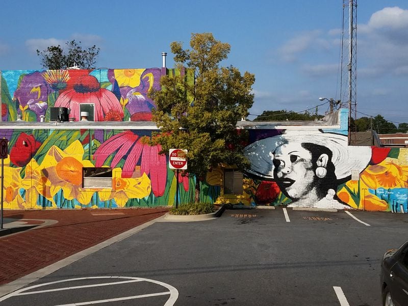 In 2018, Charmaine Minniefield completed this mural in Hapeville, which pays tribute to Hapeville’s first African American business owner, Marjorie Protho, a local florist. Minniefield is currently working on the Praise House Project, which will place site-specific art installations in three locations throughout the metro Atlanta area designed to uplift the African American history of each community. (streetartmap.org, courtesy of ArtsATL)