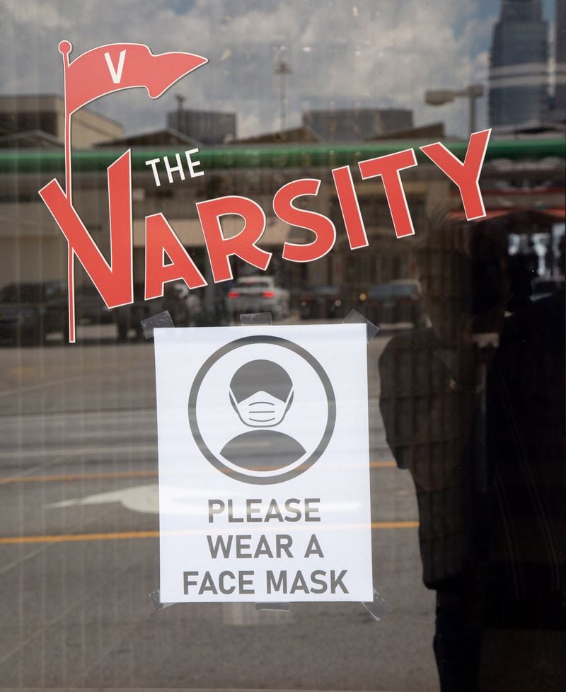 A sign is posted on the door of the Varsity. STEVE SCHAEFER FOR THE ATLANTA JOURNAL-CONSTITUTION