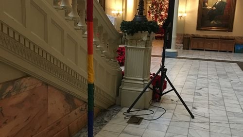 A Gay Pride Festivus Pole stands vigil in the Georgia Capitol