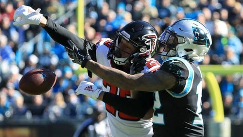 Falcons cornerback Isaiah Oliver breaks up a pass to Panthers wide receiver D.J. Moore Sunday, Nov. 19, 2019, at Bank of America Stadium in Charlotte.