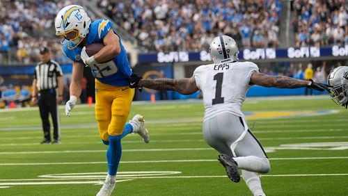 Los Angeles Chargers wide receiver Ladd McConkey (15) runs toward the end zone to score against Las Vegas Raiders safety Marcus Epps (1) during the second half of an NFL football game, Sunday, Sept. 8, 2024, in Inglewood, Calif. (AP Photo/Marcio Jose Sanchez)