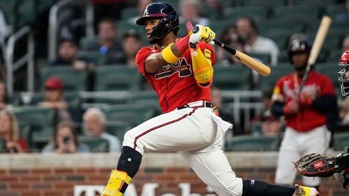 Ronald Acuna Jr. singles in the first inning of Friday's game against the Washington Nationals. (AP Photo/Mike Stewart)