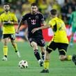 Inter Miami's Lionel Messi dribbles the ball as Columbus Crew's Alexandru Matan defends during the first half of an MLS soccer match Wednesday, Oct. 2, 2024, in Columbus, Ohio. (AP Photo/Jay LaPrete)