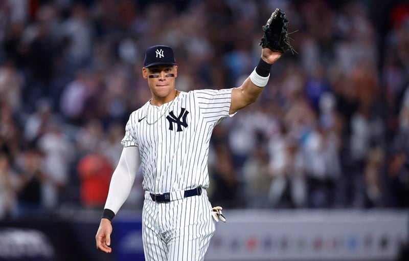 Aaron Judge waves to fans after the New York Yankees clinched the American League East title, Thursday, Sept. 26, 2024, in New York. (AP Photo/Noah K. Murray)