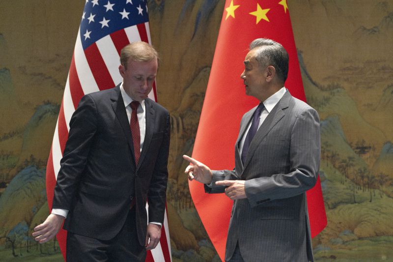 Wang Yi, right, the director of the Communist Party's Central Foreign Affairs Commission Office gestures to White House national security adviser Jake Sullivan, before their talk at Yanqi lake in Beijing, Tuesday, Aug. 27, 2024. (AP Photo/Ng Han Guan, Pool)