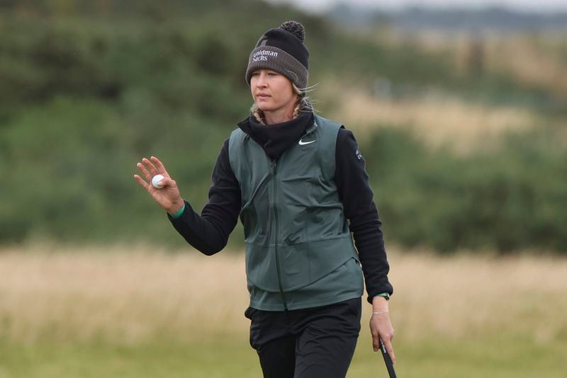 Nelly Korda, of the United States, acknowledges the crowd after after getting a birdie on the 10th green during the final round of the Women's British Open golf championship, in St. Andrews, Scotland, Sunday, Aug. 25, 2024. (AP Photo/Scott Heppell)