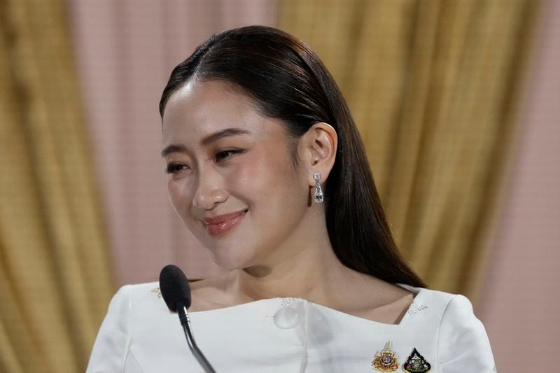 Thailand's new Prime Minister Paetongtarn Shinawatra talks to media after receiving a royal letter of endorsement for the post at the Pheu Thai party headquarters in Bangkok, Thailand Sunday, Aug. 18, 2024. (AP Photo/Sakchai Lalit)