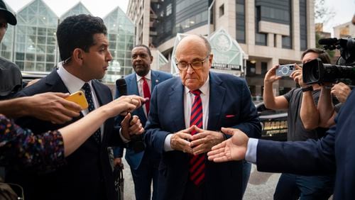 Rudy Giuliani on his way to appear before a grand jury at the Fulton County Courthouse last August. He is one of 19 defendants in a criminal case involving former President Donald Trump's campaign to overturn the 2020 election in Georgia. (Nicole Craine/The New York Times)