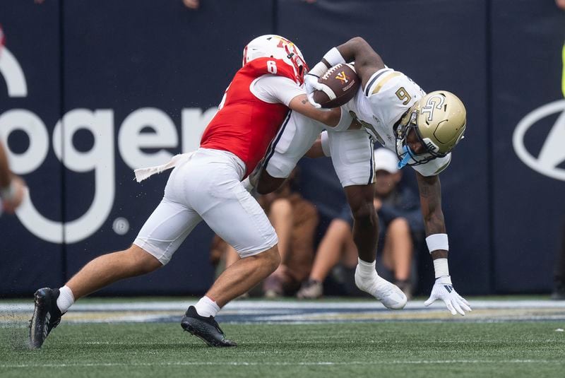 Georgia Tech wide receiver Avery Boyd (9) is stopped by Virginia Military Institute's Steven Riveros (9) as he returns a punt during the first half of a NCAA college football game Saturday, Sept. 14, 2024, in Atlanta. (AP Photo/John Bazemore)