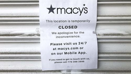 A sign informs customers of the temporary closure of Macy’s at Perimeter Center Mall in Dunwoody. Many stores in the mall, including Macy’s and Nordstrom, are closed until further notice due to COVID-19. (ALYSSA POINTER/ALYSSA.POINTER@AJC.COM)