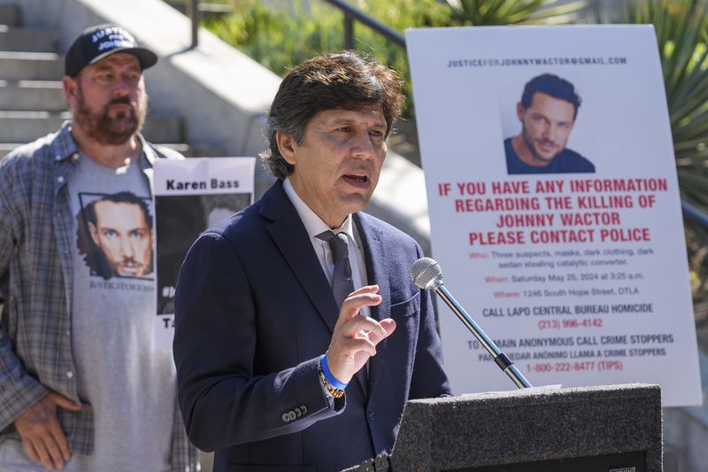 Los Angeles council member Kevin de Leon, surrounded by friends of late actor Johnny Wactor, pictured, speaks during a news conference outside Los Angeles City Hall, in Los Angeles Tuesday, Aug. 13, 2024, asking citizens to help find the suspects that murdered the former "General Hospital" actor. (AP Photo/Damian Dovarganes)