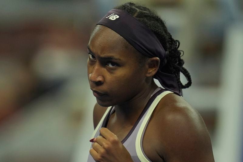 Coco Gauff of the United States reacts during play against Naomi Osaka of Japan in a women's singles match for the China Open tennis tournament held at the National Tennis Center in Beijing, Tuesday, Oct. 1, 2024. (AP Photo/Ng Han Guan)