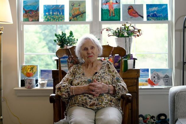 Lillian Mortimer never expected to live anything close to what she has. The 107-year-old, who lives in an assisted living facility in Cobb County, thrives staying busy, including taking painting classes for the first time in her life. (Robyn Hutson/AJC)