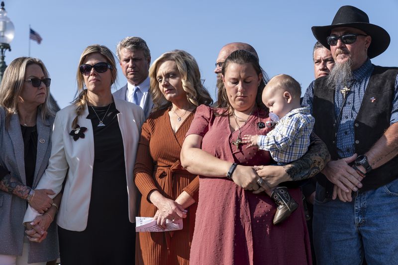 Families of American military members who were killed during the evacuation in Kabul, listen as House Foreign Affairs Committee Chairman Michael McCaul, R-Texas, speaks to reporters about his panel's Afghanistan Report and the findings of its three-year investigation into the U.S. withdrawal from Afghanistan, at the Capitol in Washington, Monday, Sept. 9, 2024. (AP Photo/J. Scott Applewhite)