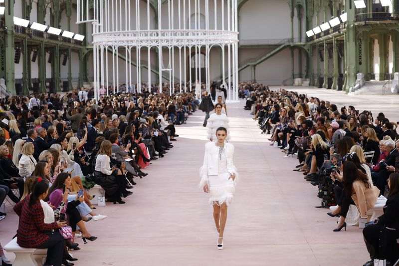 Models wear creations as part of the Chanel Spring/Summer 2025 collection presented Tuesday, Oct. 1, 2024, in Paris. (Photo by Vianney Le Caer/Invision/AP)