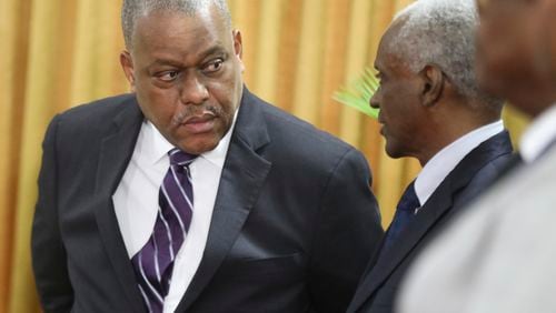 FILE - Haitian Prime Minister Garry Conille, left, speaks to Transitional Council President Edgard Leblanc Fils, during Conille's swearing-in ceremony in Port-au-Prince, Haiti, June 3, 2024. U.S. officials asked Conille on July 2, 2024, to prioritize the establishment of an electoral council as the country strives to rebuild its government. (AP Photo/Odelyn Joseph, File)