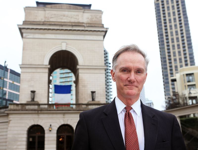 Rodney Cook stands in front of the Millennium Gate in Atlantic Station in downtown Atlanta. Cook’s nonprofit the National Monuments Foundation funded and built the landmark and museum. A bigger project, $25 million worth of statues and monuments in a park named after his father Rodney Cook Sr. Park, is a work in progress.