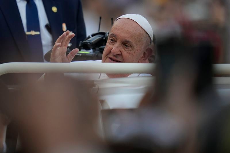 Pope Francis arrives to lead the holy mass at Gelora Bung Karno Stadium in Jakarta, Indonesia, Thursday, Sept. 5, 2024. (AP Photo/Achmad Ibrahim, Pool)