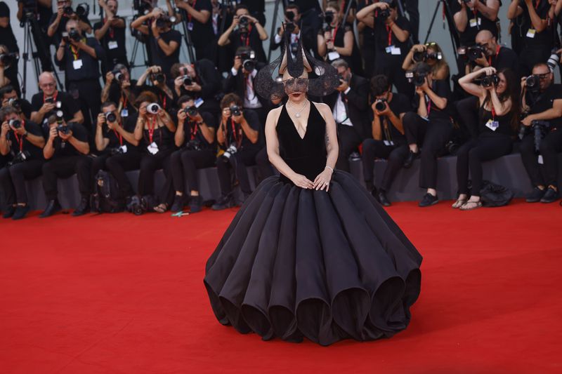 Lady Gaga poses for photographers upon arrival for the premiere of the film 'Joker: Folie A Deux' during the 81st edition of the Venice Film Festival in Venice, Italy, on Wednesday, Sept. 4, 2024. (Photo by Vianney Le Caer/Invision/AP)