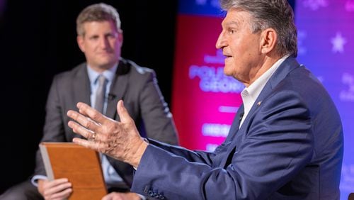 U.S. Sen. Joe Manchin, right, responds to a question from Atlanta Journal-Constitution political reporter Greg Bluestein during a town hall Friday at Georgia State University. Manchin, who is considering the possibility of running for president this year as an independent, said he is “traveling the country and speaking out to see if there is an interest in creating a movement to mobilize and bring Americans together.” (Arvin Temkar / arvin.temkar@ajc.com)