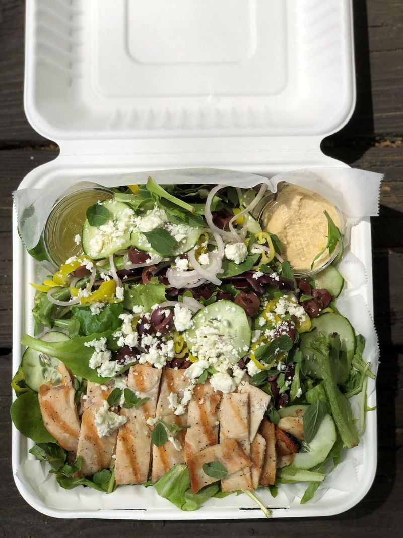 The grilled chicken Greek salad is one of the offerings at Rising Son in Avondale Estates. CONTRIBUTED BY WENDELL BROCK