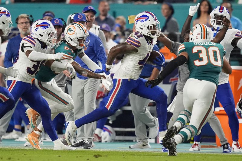 Buffalo Bills cornerback Christian Benford (47) runs after intercepting a pass during the first half of an NFL football game against the Miami Dolphins, Thursday, Sept. 12, 2024, in Miami Gardens, Fla. (AP Photo/Rebecca Blackwell)