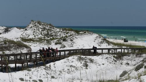 A photo from the Walton County Sheriff's Office shows first responders carrying a Florida Panhandle shark attack victim up the boardwalk on Friday, June 7, 2024.
