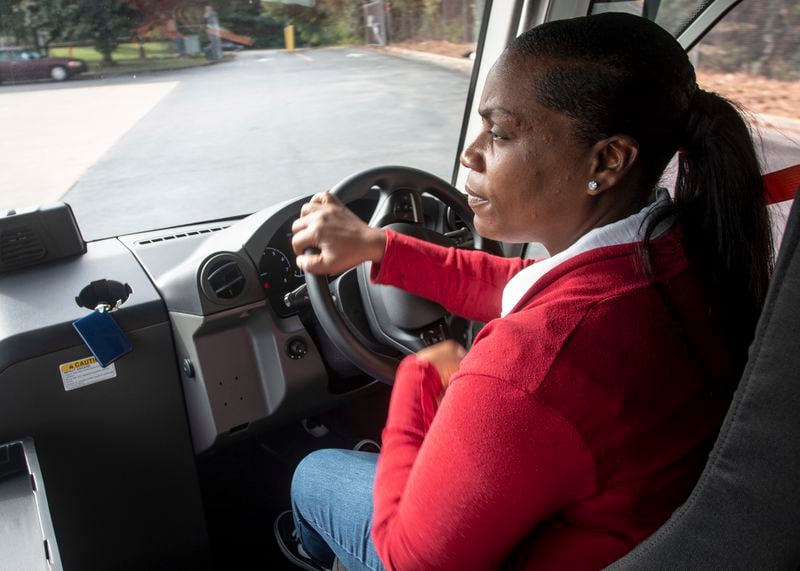 U.S. Postal Service delivery driver Avis Stonum maneuvers one the the newest fleet vehicles through the work lot of a postal facility on Thursday, Sept. 5, 2024, in Athens, Ga. (AP Photo/Ron Harris)