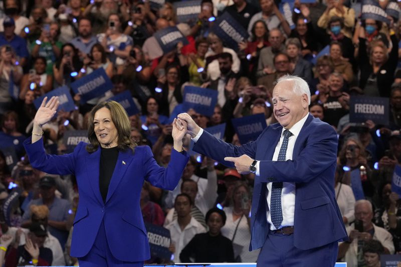 Democratic presidential nominee Vice President Kamala Harris and running mate Minnesota Gov. Tim Walz appear at the Fiserv Forum during a campaign rally in Milwaukee, Tuesday, Aug. 20, 2024. (AP Photo/Jacquelyn Martin)