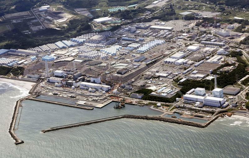 FILE - This aerial view shows the Fukushima Daiichi nuclear power plant in Fukushima, northern Japan, on Aug. 24, 2023, shortly after its operator Tokyo Electric Power Company Holdings TEPCO began releasing its first batch of treated radioactive water into the Pacific Ocean. (Kyodo News via AP, File)