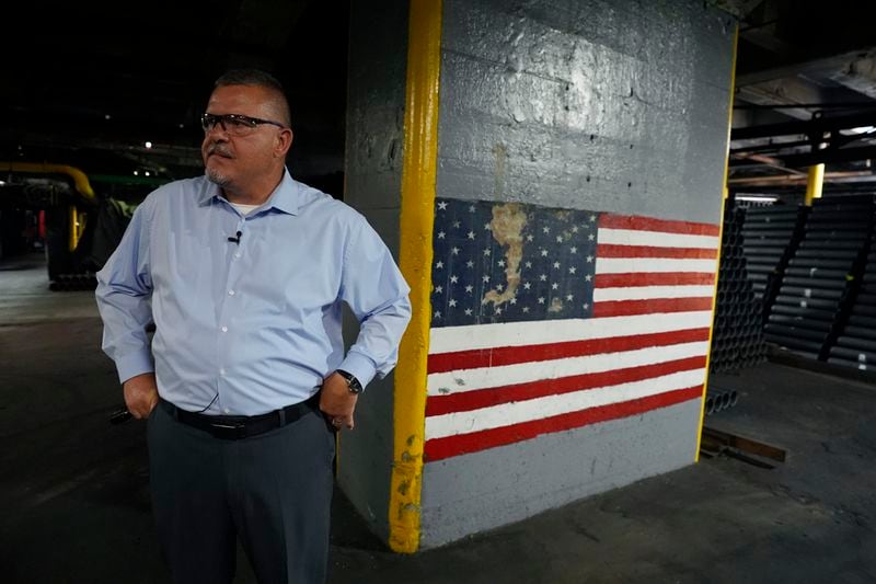 Richard Hansen, a Navy veteran and the Army commander's representative at the Scranton Army Ammunition Plant pauses during a tour of the manufacturing process of 155 mm M795 artillery projectiles, Tuesday, Aug. 27, 2024, in Scranton, Pa. (AP Photo/Matt Slocum)