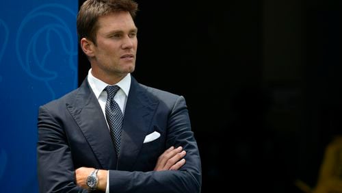 Tom Brady watches warmups before a preseason NFL football game between the Dallas Cowboys and Los Angeles Rams, Sunday, Aug. 11, 2024, in Inglewood, Calif. (AP Photo/Gregory Bull)