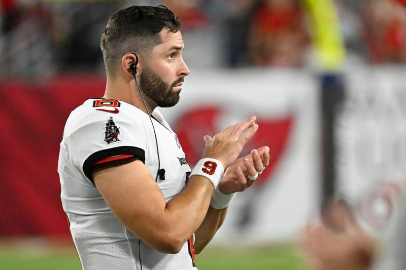 Tampa Bay Buccaneers quarterback Baker Mayfield (6) watches from the sidelines during the first half of a pre season NFL football game against the Miami Dolphins, Friday, Aug. 23, 2024, in Tampa, Fla. (AP Photo/Jason Behnken)