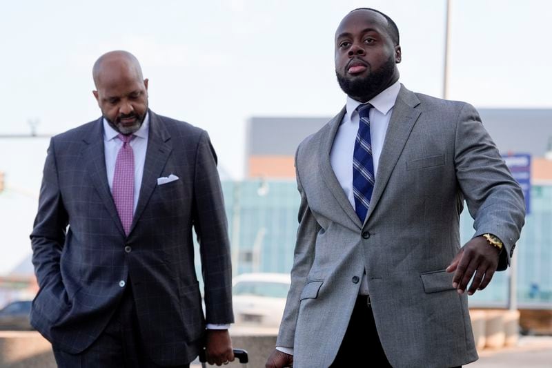 Former Memphis police officer Tadarrius Bean, right, arrives at the federal courthouse with attorney John Keith Perry, right, for the second day of jury selection for the trial in the Tyre Nichols case Tuesday, Sept. 10, 2024, in Memphis, Tenn. (AP Photo/George Walker IV)