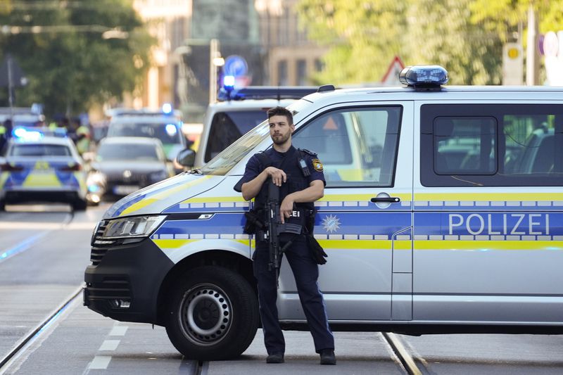 Police officer block a street after police fired shots at a suspicious person near the Israeli Consulate and a museum on the city's Nazi-era history in Munich, Germany, Thursday, Sept. 5, 2024. (AP Photo/Matthias Schrader)