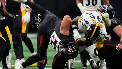 Atlanta Falcons guard Chris Lindstrom (63) blocks Pittsburgh Steelers defensive tackle Keeanu Benton (95) during the first half of an NFL football game Sunday, Sept. 8, 2024, in Atlanta. (AP Photo/John Bazemore)