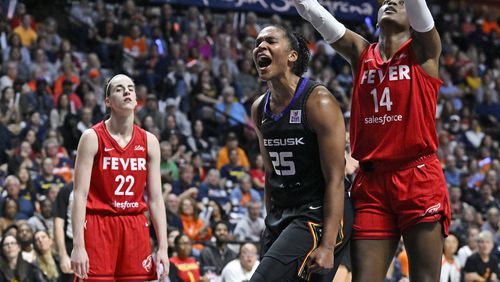 Connecticut Sun forward Alyssa Thomas (25) celebrates a basket while being fouled during the second half in Game 2 of a first-round WNBA basketball playoff series against the Indiana Fever, Wednesday, Sept. 25, 2024, in Uncasville, Conn. (AP Photo/Jessica Hill)