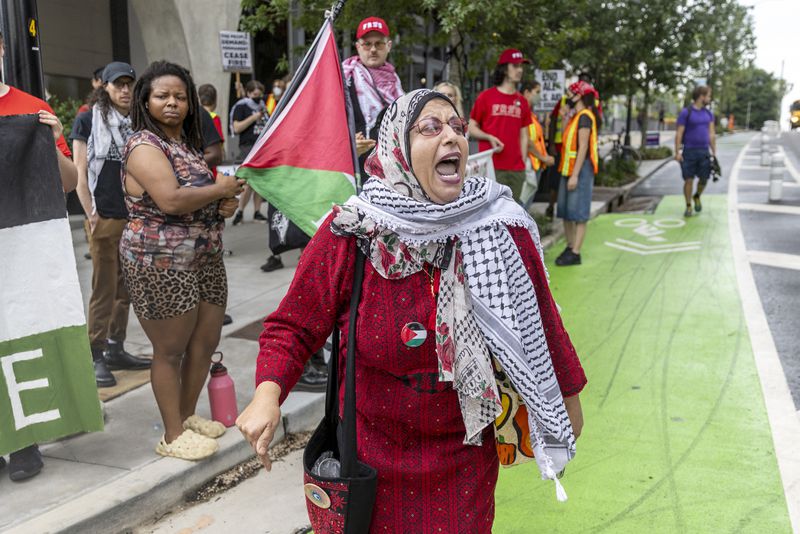 Jawahir Kamil leads the Palestine protester on 10th Street near the Trump/Biden Debate site in Atlanta on Thursday, June 27, 2024. (Steve Schaefer / AJC)