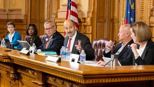 Georgia Election Board member Sara Tindall Ghazal, from left, member Janelle King, Executive Director Mike Coan, Chairman John Fervier, member Rick Jeffares, and member Janice Johnston appear during a board meeting at the Capitol in Atlanta in September. (Arvin Temkar / AJC)