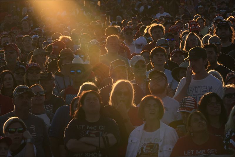 Supporters listen as Republican presidential nominee former President Donald Trump speaks during a campaign rally at the Butler Farm Show, Saturday, Oct. 5, 2024, in Butler, Pa. (AP Photo/Julia Demaree Nikhinson)